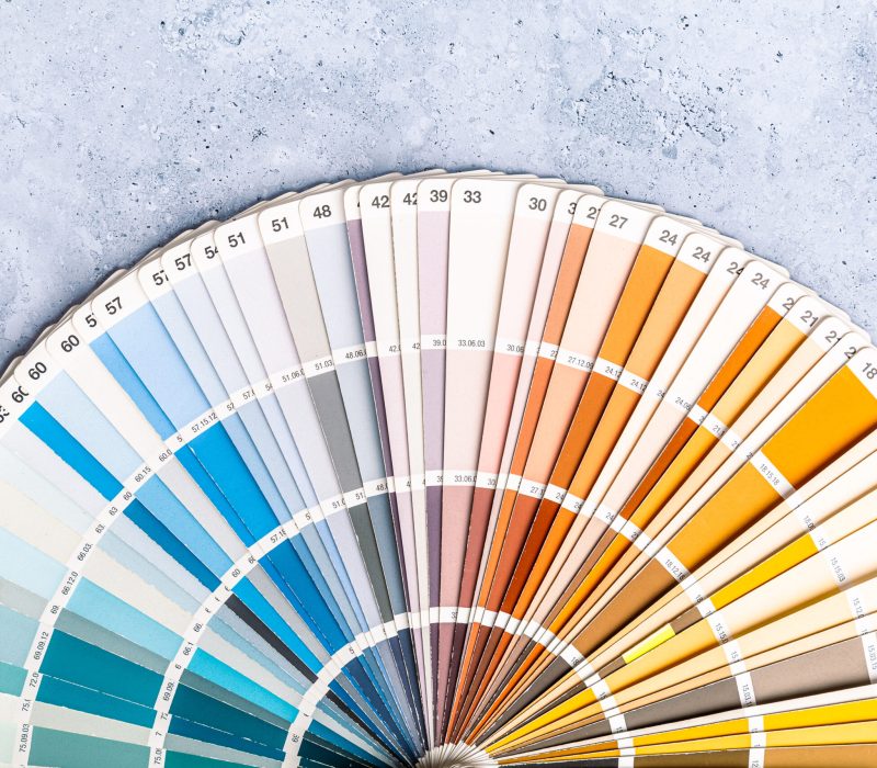 Industrial color palette guide of paint samples catalog on grey background